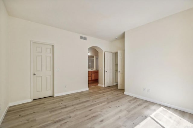 empty room with light hardwood / wood-style floors