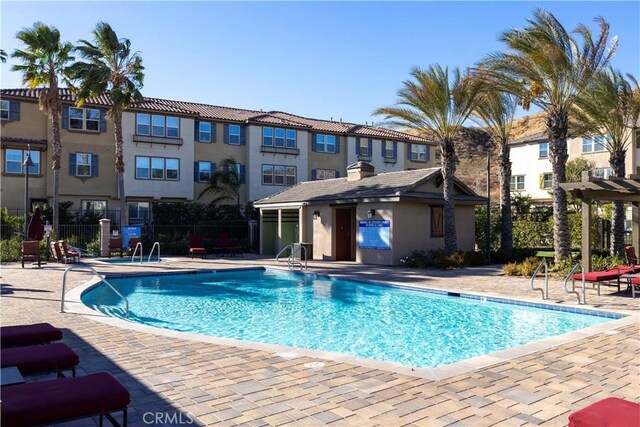 view of swimming pool featuring a patio area