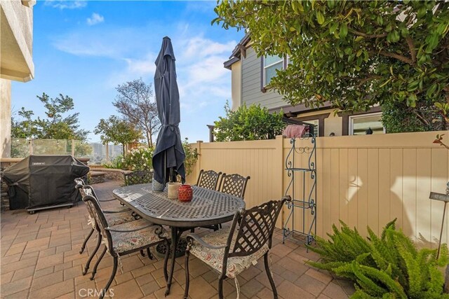 view of patio featuring a grill