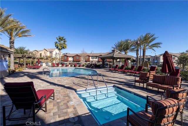 view of pool with a gazebo and a patio