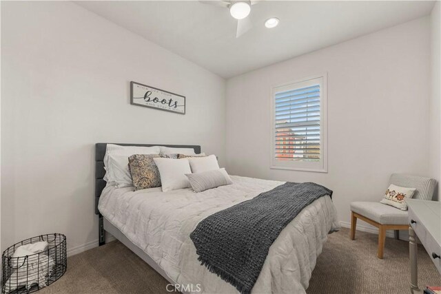 bedroom with ceiling fan and carpet floors