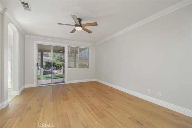 empty room with crown molding, ceiling fan, and light wood-type flooring