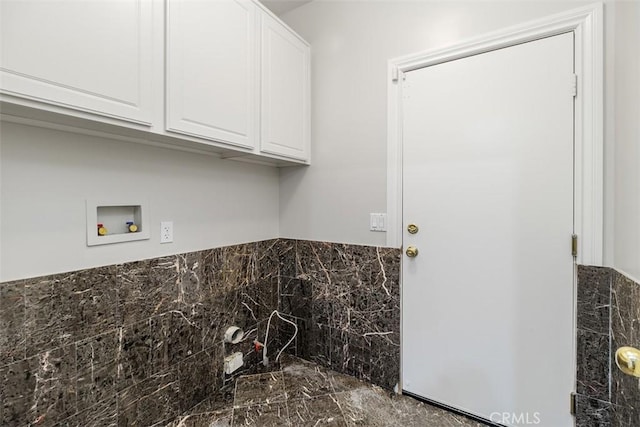 laundry room featuring cabinets and washer hookup