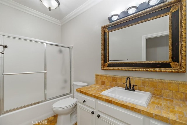 full bathroom featuring tasteful backsplash, enclosed tub / shower combo, vanity, toilet, and crown molding