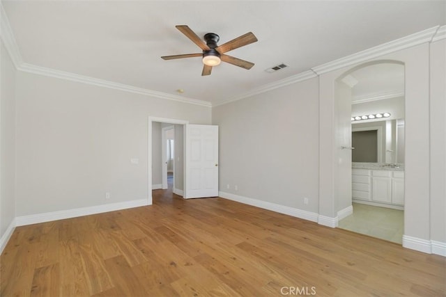 spare room with ornamental molding, ceiling fan, and light hardwood / wood-style floors