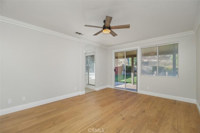 empty room with crown molding, light hardwood / wood-style flooring, and ceiling fan