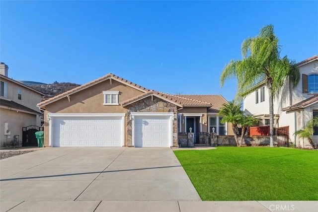 view of front of home featuring a garage and a front lawn