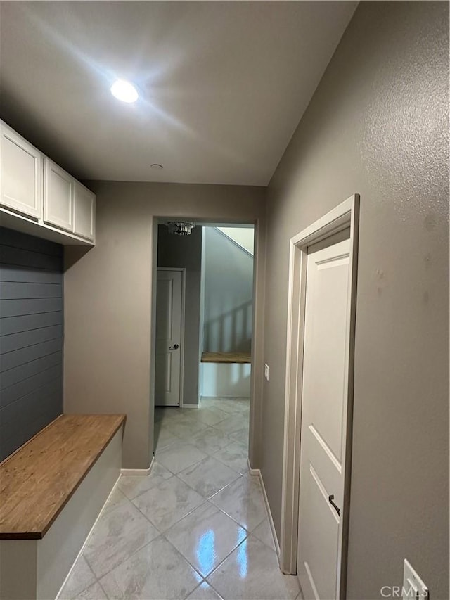 mudroom with light tile patterned flooring