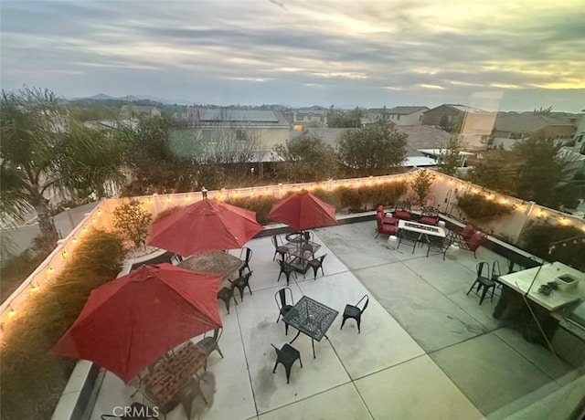 view of patio terrace at dusk