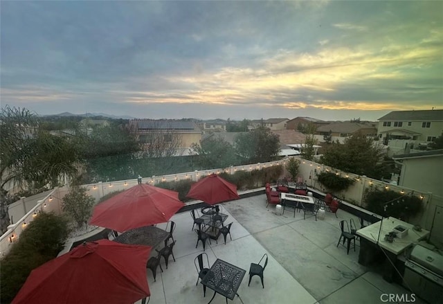 view of patio terrace at dusk