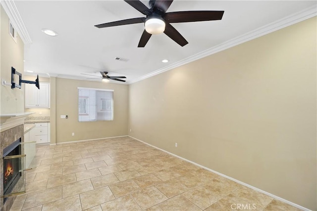 unfurnished living room featuring crown molding, a fireplace, and ceiling fan