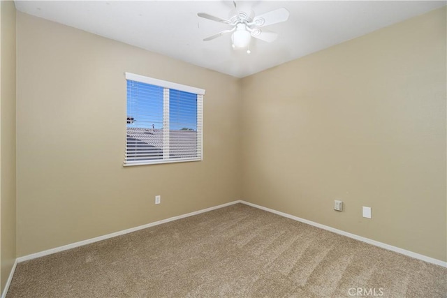 spare room featuring carpet flooring and ceiling fan