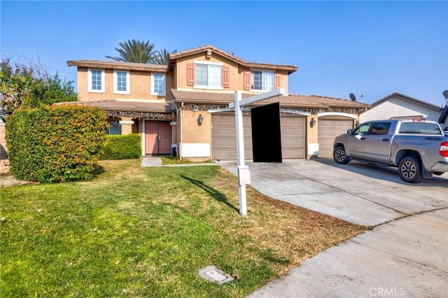 view of property featuring a garage and a front yard