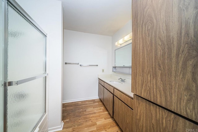 bathroom featuring vanity and wood-type flooring