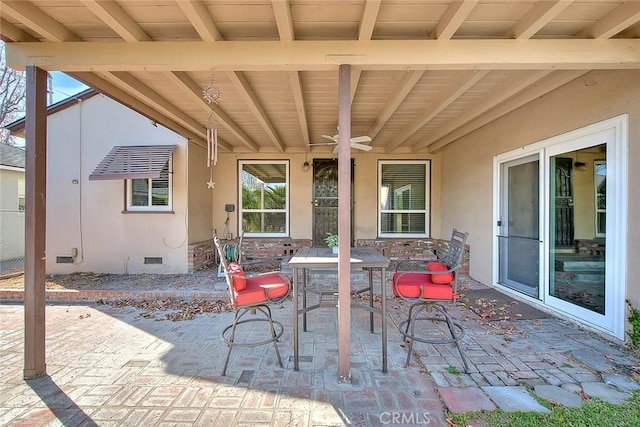 view of patio with a ceiling fan and outdoor dining space