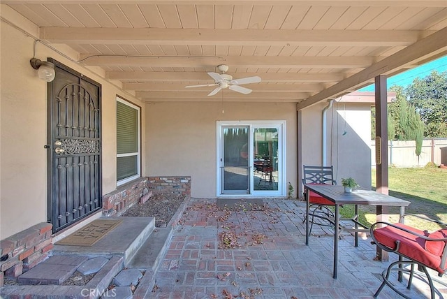 view of patio / terrace featuring ceiling fan and fence