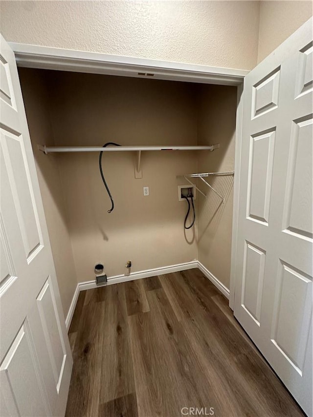 laundry room featuring dark wood-type flooring, washer hookup, and gas dryer hookup