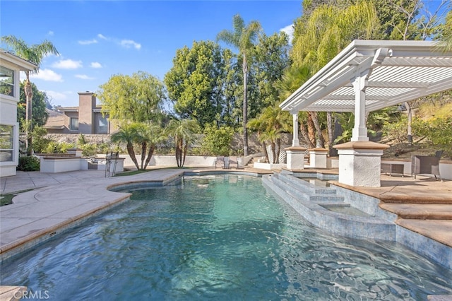 view of swimming pool featuring a pergola and a patio area