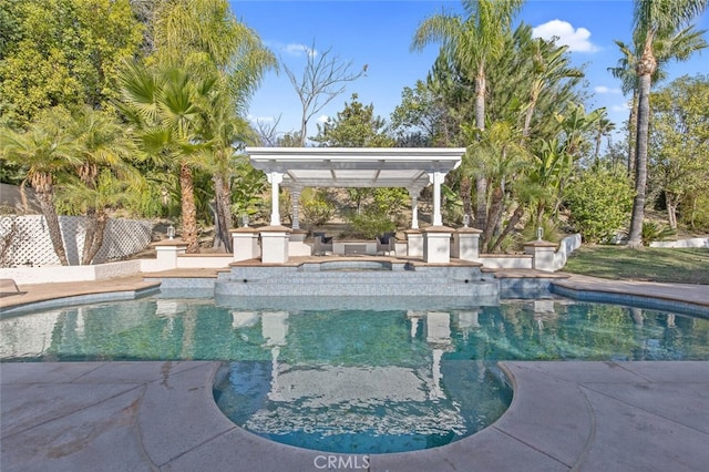 view of swimming pool with area for grilling and a pergola