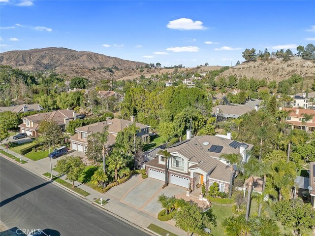 birds eye view of property featuring a mountain view