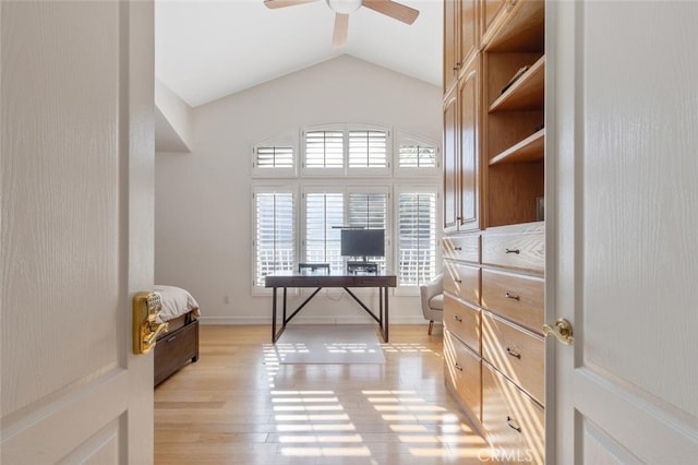 office with lofted ceiling, ceiling fan, and light hardwood / wood-style flooring