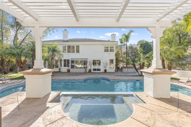 view of pool featuring a pergola, a patio, and an in ground hot tub