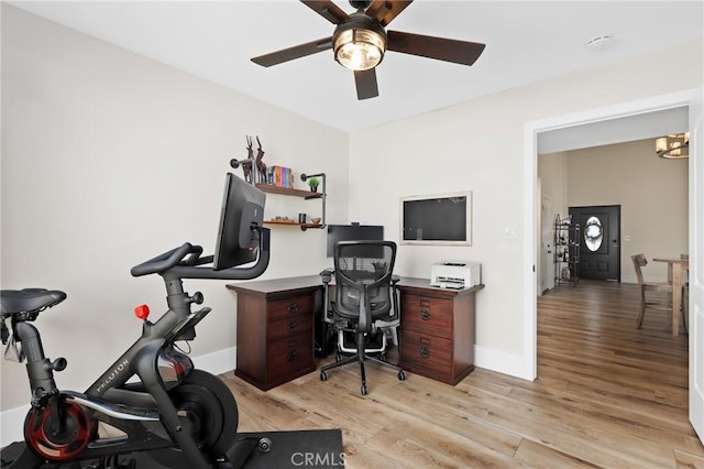 office space featuring ceiling fan and light hardwood / wood-style flooring