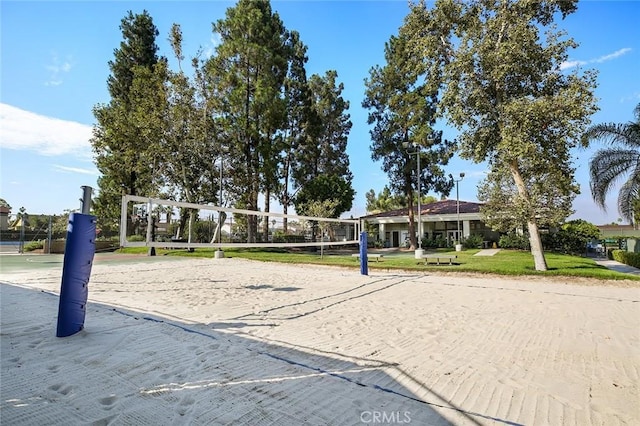 view of community featuring a yard and volleyball court