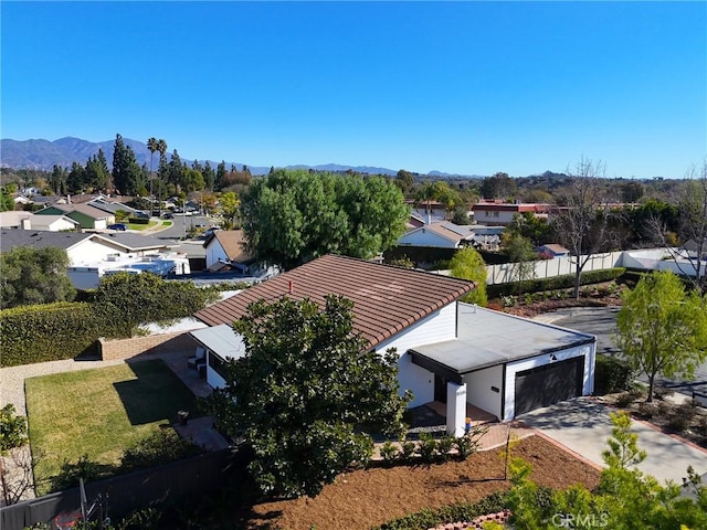 birds eye view of property with a mountain view