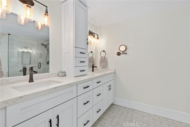 bathroom featuring an enclosed shower and vanity