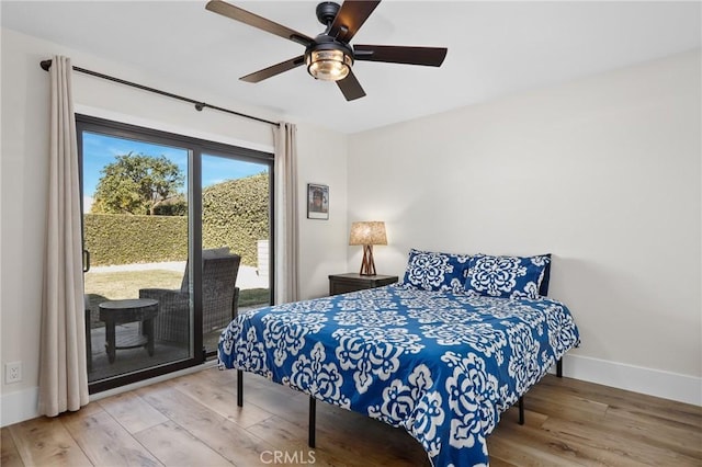 bedroom with ceiling fan, access to exterior, and wood-type flooring