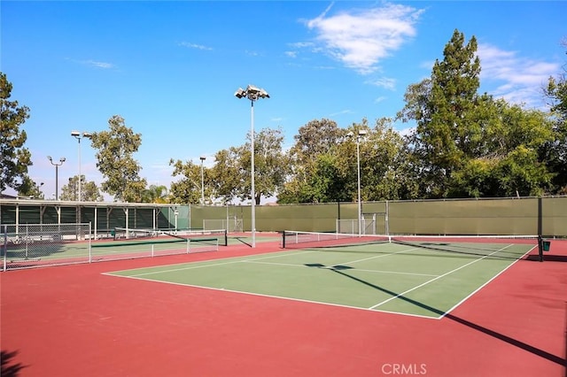 view of tennis court featuring basketball court