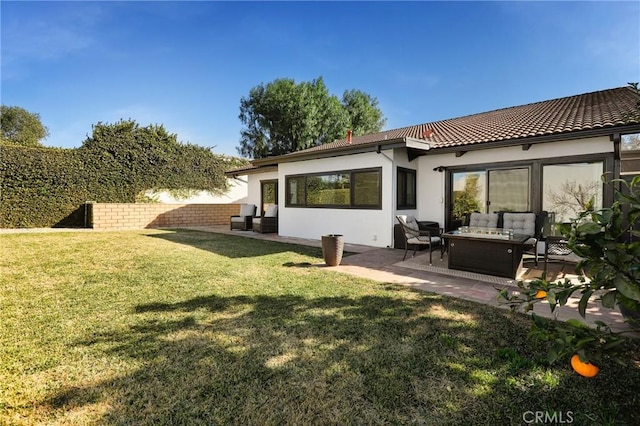 rear view of house with an outdoor hangout area, a patio, and a yard