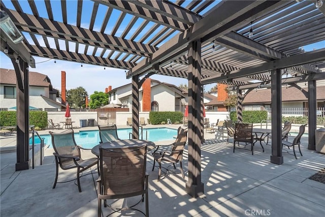 view of patio / terrace featuring a pergola and a community pool