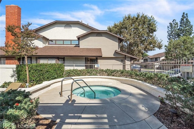 view of pool with a community hot tub