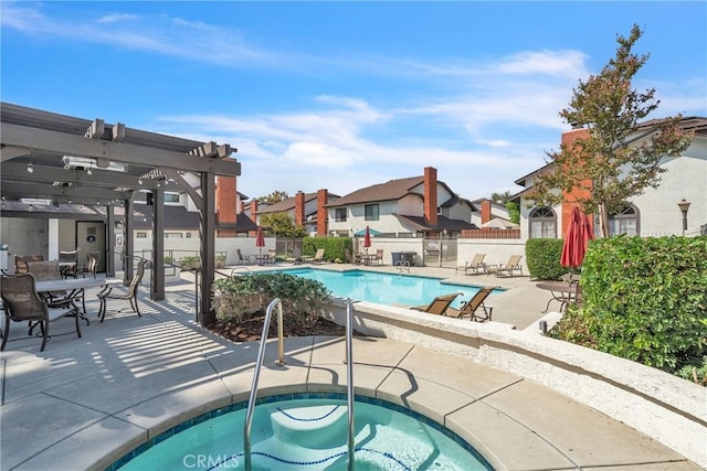 view of swimming pool featuring a patio area, a community hot tub, and a pergola