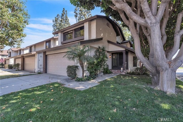 view of front of home with a front yard and a garage