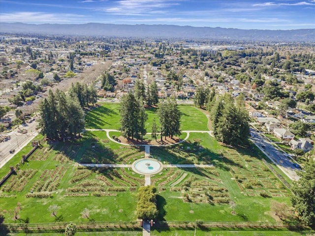 birds eye view of property with a mountain view