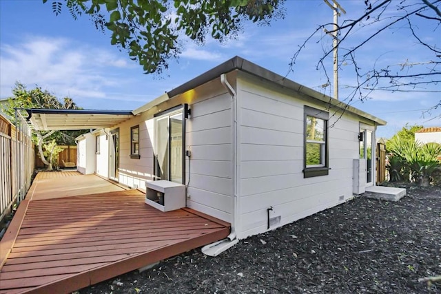 view of side of property featuring a deck