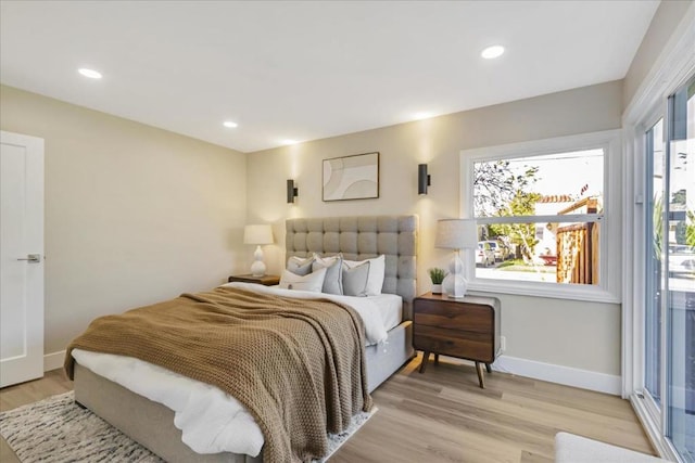 bedroom with light hardwood / wood-style floors