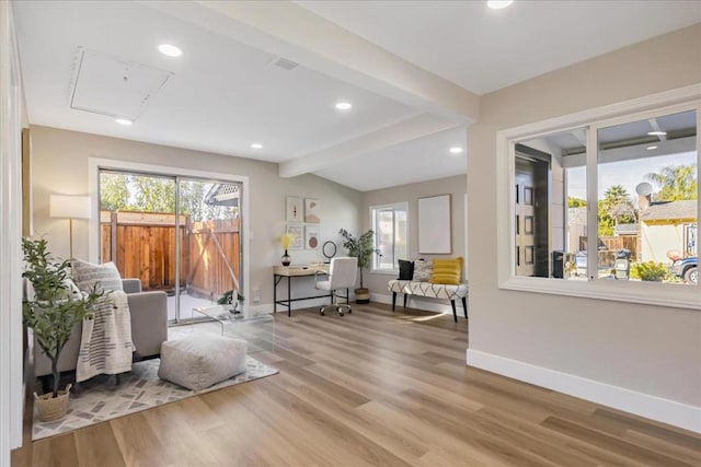 interior space with light hardwood / wood-style flooring and vaulted ceiling