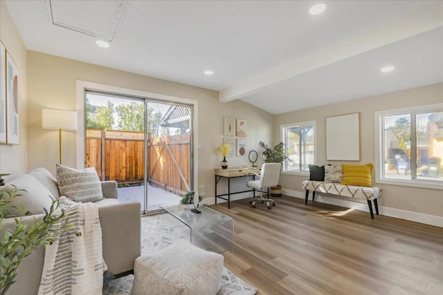 living room featuring lofted ceiling with beams and light wood-type flooring