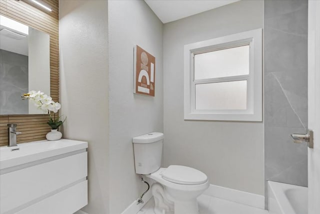 bathroom with toilet, vanity, and a tub to relax in