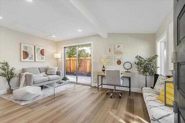 living room featuring light hardwood / wood-style flooring and lofted ceiling with beams