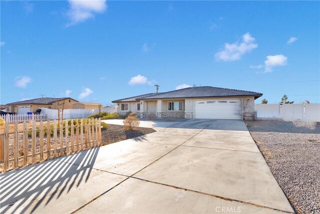 ranch-style home featuring a garage