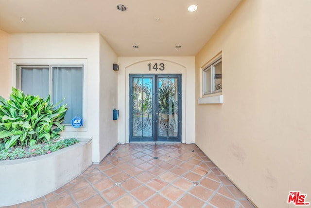 entrance to property featuring french doors