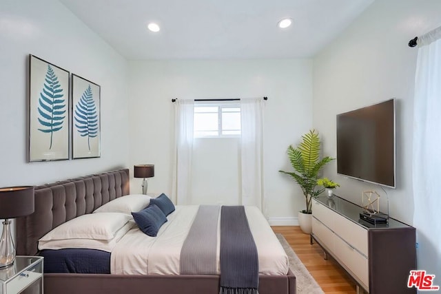 bedroom featuring light wood-type flooring