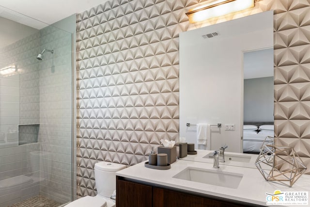 bathroom with a shower, toilet, and vanity