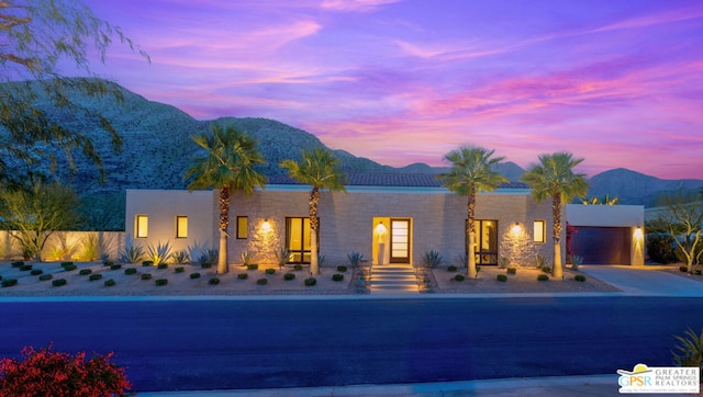 view of front of house featuring a mountain view and a garage