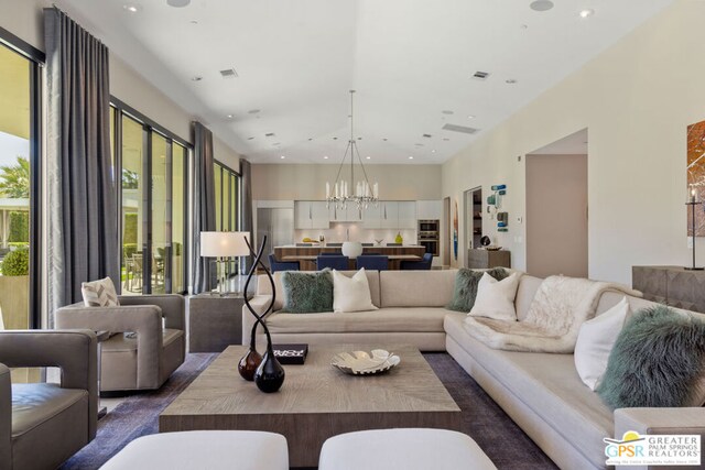 living room with an inviting chandelier